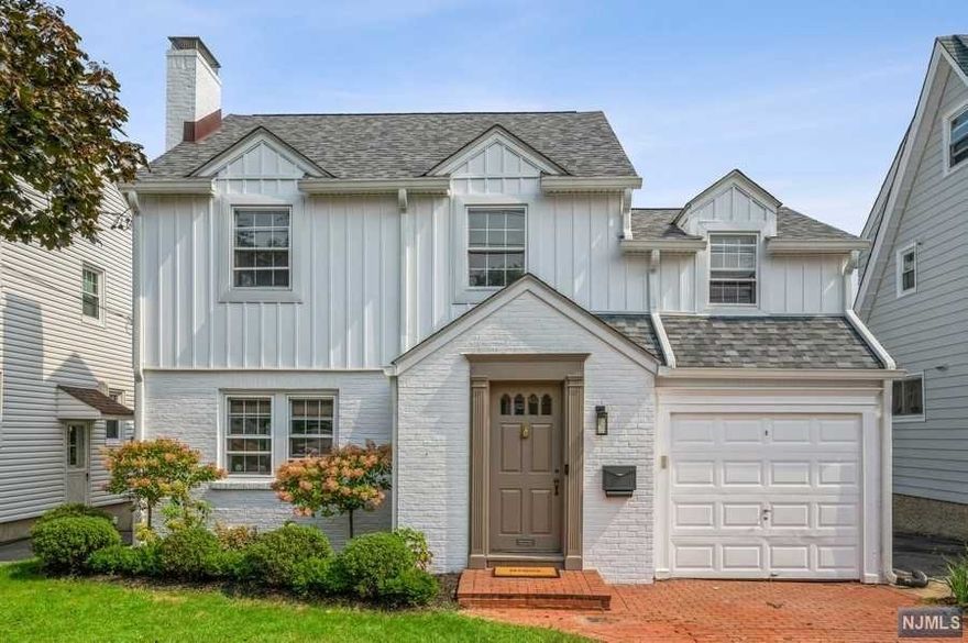 Beautifully updated Colonial with 3 BR and 1.1 BA sits on a manicured lot on a quiet, dead-end street. Just a few doors down from Brookdale Park, this home is located close to shopping, dining, schools, and NYC train. Updated to perfection, this home features beautiful hardwood floors, bright, and open rooms with space for entertaining. An inviting brick paver driveway and entry lead you inside to a vestibule with a coat closet opening to a sun-washed LR with a wood-burning fireplace and a spacious formal DR. The stylish and sunny eat-in kitchen is equipped with quartz counters, SS appliances, a breakfast bar, and side-by-side windows letting in lots of natural light. On the second floor is a large primary bedroom with three deep closets, two additional bedrooms, and a remodeled marble hallway bathroom with a soaking tub, floor heating and separate glass shower. The partially finished basement with high ceilings offers a laundry area, storage, and great potential for expansion.