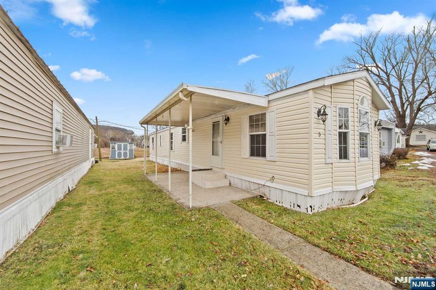 Live along the Delaware River in this mobile home offering 820 square feet in a quiet community. This 60 ft. unit features central A/C, an eat-in kitchen with pantry, dishwasher, refrigerator, microwave, electric stove, and in-unit laundry. Spacious living room, two bedrooms, full bath, patio, yard area. Monthly fee includes water, sewer, property taxes, trash, and common area maintenance. Background check and application required. Conveniently located just one hour from NYC and two hours from Philadelphia. Set in scenic Warren County which offers endless attractions, including, scenic state forests, reservoirs, wildlife preserves, local farms, wineries, casinos, outlets, lakes and rivers for outdoor recreation. The virtual tour link offers an immersive experience with a full video tour, interactive 3D model, detailed floor plans, room dimensions & photos.https://www.njproper.com/190-us46-5