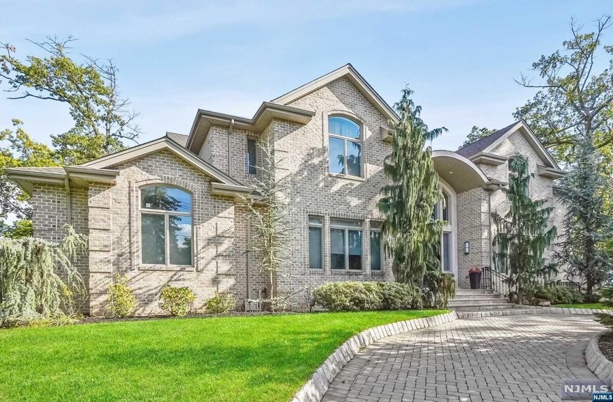 Beautiful Custom Built all Brick 9 year young Colonial located in the prestigious North Cliffs, Pride of ownership, immaculately built for owner's own residence, over 6000 SQFT including Basement, 2 story entry foyer, Radiant heat on entire first floor and on 2nd fl master bath This home boasts ultra modern kitchen with all Thermador Appliances, New Smart Refrigerator with WIFI, Quartz counter top, cabinets with Roble Tierra Finishes, large breakfast area, large dining room, 2nd fl features 4 large bedrooms: Master Suite with high ceiling with huge walk-in closet, Jr Master Suite, 2 large bedrooms and a bath, Finished basement offers 2 additional bedrooms, full bath, a theatre, family room, golf practice area, and a space for gym/ping pong table/ pool table. Laundry with storage, The house has 4 zones a/c, 13 zones heating and a Koehler Generator, 3 car garage, steps to NYC, transportation, minutes to GWB, best golf courses/country clubs are nearby, low taxes.