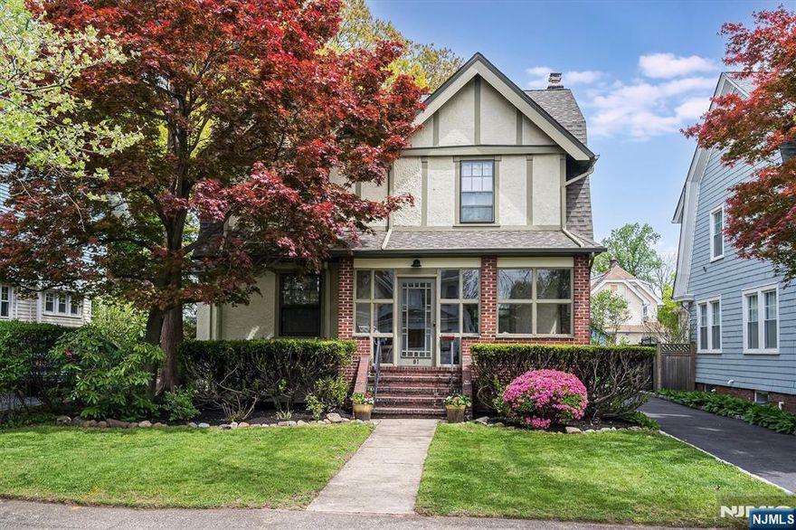 Storybook charm meets everyday functionality in this beautifully maintained Craftsman Colonial, ideally located just a short trip to the Midtown Direct train and vibrant downtown Bloomfield Center. Brimming with character, the home showcases original details throughout, including parquet hardwood floors, a living room with fireplace and wood beam ceiling, and irresistible curb appeal. An inviting enclosed front porch extends your living space nearly year-round, perfect for relaxing or entertaining. The updated kitchen features a separate butler's pantry along with dedicated table space and built-in bench seating, creating a warm and practical hub of the home. The second level offers three bedrooms and a full bath, while the third floor provides a fourth bedroom plus a flexible office or playroom. A finished basement with a full bath and rec room adds even more versatile living space. Enjoy the best of both worlds with close proximity to Watsessing Park and your own private, park-like backyard oasis complete with patio, shed, and one-car detached garage. Near Six Points, FoodTown, Washington Street shops and restaurants, and local favorites like Skidoo Coffee, this home blends timeless charm with modern convenience.
