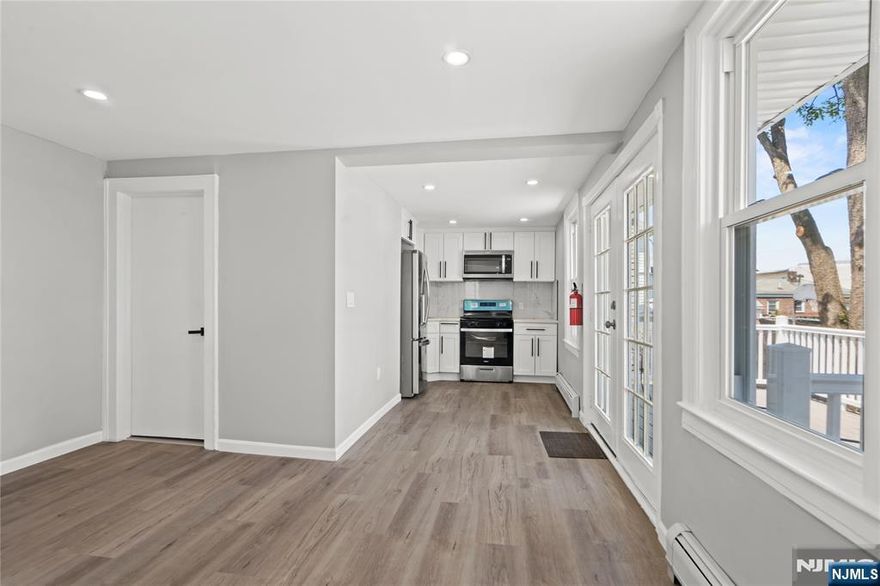 Welcome to this beautifully renovated 2-family home featuring 4 bedrooms and 3 full bathrooms, perfect for investors or owner-occupants seeking rental income. Each unit offers a modern, comfortable lifestyle with brand-new appliances, stylish finishes, and thoughtful upgrades throughout. Both units include spacious bedrooms, each with contemporary LED-lit ceiling fans, as well as fully updated bathrooms. The home is equipped with all-new windows and a tankless hot water heater for energy efficiency. The lower level offers a large walk-out basement with laundry hookups and ample space for storage or additional living space. Step outside to enjoy a private deck, ideal for relaxing or entertaining. Call your agent and book your showing today!