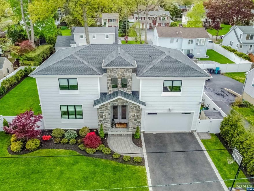 WELCOME to this 2018 Magnificent Colonial in the sought out TOWN of HILLSDALE. Spacious-Open Concept full of Natural Sunlight & Modern Lines was built with High-Quality Materials and Attention to Detail. Over 4,000 sq ft home features Hardiplank Siding & Grand Stone Exterior with Lush Landscaping. Two-Story High Foyer & Kitchen with a Vast Living Room & Spacious Formal Dining Room that share a Stunning Freestanding Fireplace, Designer Kitchen with Oversized Island making it a Great Space for Family & Entertaining, plus a Bedroom & Powder Room completes the 1st Floor. Climb the Grand Staircase to find 3 more Spacious Bedrooms, Full Bath, Custom Laundry Room & the PRIMARY SUITE w/spa-like Bathroom and Huge WIC. The Finished Expansive Lower Level has 10' ceilings, Bedroom, Full Bath, Recreation/Gym Area & Family Room. Outdoor enjoy the Patio with Pavers & a Built-in Fire Pit in a Fenced in Yard. Landscape Lighting Illuminates the property Beautifully in the Evenings!