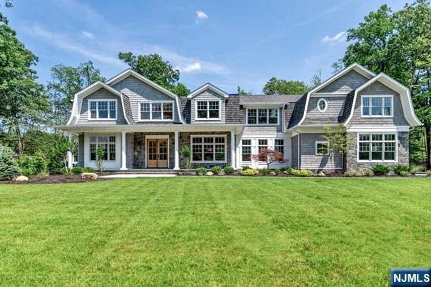 Nestled in the heart of Franklin Lakes, this spectacular Hamptons-style estate boasts 6 bedrooms, 7.5 bathrooms, & 9,600 sq ft. Crafted by renowned architect Dan D'Agostino & interior designer Ariella Horowitz, every detail of this custom masterpiece exudes sophistication & style. Situated on 2 serene acres on a prestigious cul-de-sac, privacy & exclusivity are paramount. The main level is a symphony of grandeur w/ gourmet kitchen, LR, DR, study, guest suite, sunrm & breathtaking great rm. Each space is meticulously designed to seamlessly blend luxury w/ functionality. Upstairs, discover 5 en-suite BRs, including a lavish primary suite & expansive bonus rm, providing ample space for relaxation & entertainment. Outside find a private sanctuary w/ bluestone patio, outdoor kitchen, covered porch w. gas fireplace, heated saltwater gunite pool w/ spa & sun deck. The lower level boasts family rm, theater, gym & nanny quarters, ensuring every need is met in this extraordinary residence.