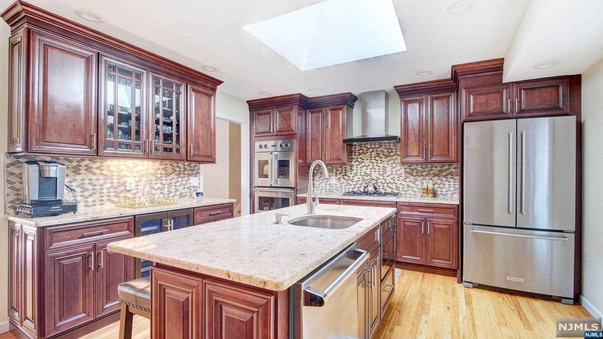 Step into luxury in this exquisite 3-bedroom, 2 1/2 split home located on the North side of River Vale, at the pinnacle of New Jersey living. The kitchen is a culinary haven, equipped with top-tier Viking appliances, ready to test out the juiciest steaks for a gourmet dining experience. Entertaining is a delight in the open dining area, where a thoughtfully set table overlooks a deck that boasts a panoramic view of your 1/2 acre green space for fun and play, complete with a patio and inground pool. The interior of the house features HW floors throughout, offering a seamless blend of elegance and warmth. With multiple levels, the home caters to various living needs, from working from home to finding cozy reading spots or simply lounging for a Netflix binge. After a day of work and play, retire to the primary bedroom with its ensuite for a private retreat. The second and third bedrooms offer great space, ensuring comfort and privacy. This home offers the best of suburban living.