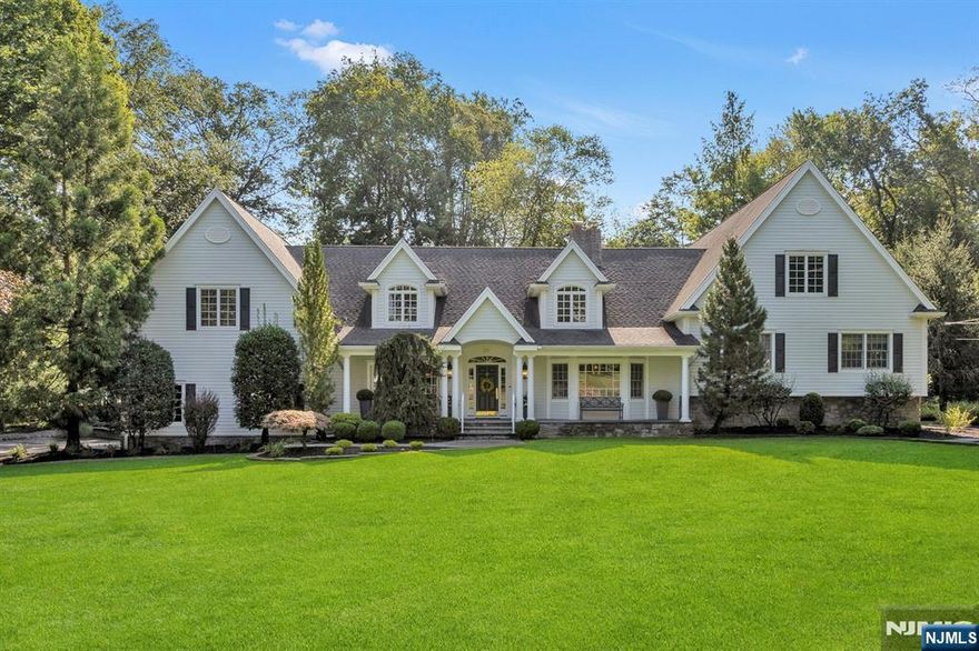 Nestled in a quiet cul-de-sac in the coveted Shadow Lake neighborhood of Franklin Lakes, this home blends timeless design w modern living that whispers warmth, sophistication & pristine detail. At the heart of the home is a custom gourmet kitchen w/a 48" range,10' island w/prep sink, Sub-Zero all fridge&freezer, 2 Miele dishwashers, steam oven & warming drawer. A Breakfast Rm & 3 season porch overlook the lush backyard. The Great Rm w beamed ceilings & two-sided fieldstone fireplace opens to a cozy paneled Study w/built-ins. The Living Rm features another fireplace, while the formal Dining Rm w/French doors flows to a covered porch. A Butler's Pantry/Bar make entertaining easy. A jewel box Powder Rm, Mud Entry & Laundry complete the 1st floor. The Primary Bedroom suite is a sanctuary of luxury w/ dual walk-in closets, spa bath w/double shower, soaking tub & radiant floors. Two add'l bedrooms share a handsome bath. The finished lower level extends the living space for play or fitness. A private Guest/Office ensuite w/ its own staircase offers a living area/office, Bedroom, Full Bath and direct access to infinite storage and over 1,500 sq ft of untapped potential - imagine a future wellness studio or additional suite. Mature landscaped grounds, bluestone porches and patios invite gatherings, while a 3-car heated garage w/in-wall storage; central vacuum; whole-house audio; water filtration; irrigation system and much more complete this meticulously maintained, special home!