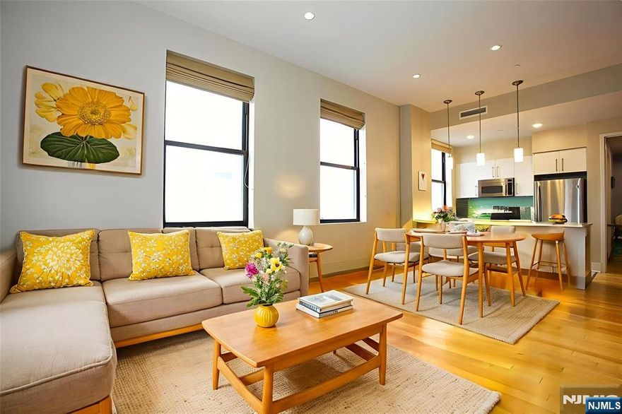 Welcome home to the historic Art Deco BEACON, offering breathtaking views of NYC, the Hudson River, and the Statue of Liberty. This stunning 2-bedroom, 2-bath corner residence spans over 1,200 square feet and is filled with natural light from eastern and southern exposures. The apartment features 12-foot ceilings, recessed lighting, a walk-in closet with custom shelving, and an in-unit washer/dryer. The gourmet kitchen is thoughtfully designed with Italian porcelain flooring, quartz countertops, and ample storageâ€”perfect for both everyday living and entertaining. Residents enjoy an exceptional suite of luxury amenities, including a doorman/concierge, shuttle service to the PATH, 24/7 fitness center, indoor pool, grotto lounge with Jacuzzi and sauna, movie theater, childrenâ€™s play areas, dog run, organic garden, sun deck with BBQs and fire pit, billiards room, and a rooftop lounge with Wi-Fi and sweeping NYC viewsâ€”and so much more. Valet parking is available for an additional fee. (First 4 pics are virtually staged)