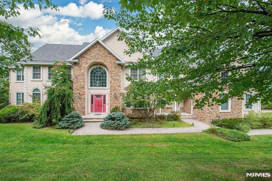 Welcome to this expansive Colonial in a prestigious neighborhood! A paver walkway leads to a grand double entry foyer and a home filled with elegance and light. The first floor offers hardwood floors, a formal dining room with moldings, gourmet EIK with Viking appliances, wine fridge, granite island & sliders to deck, open to a 2-story great room with stone fireplace & floor-to-ceiling windows. Formal living & study open to a sunroom, plus laundry, mudroom & 2 powder rooms. Upstairs, the primary suite features tray ceiling, sitting room, spa-like bath with jetted tub, stall shower & dual walk-ins. Two bedrooms share a Jack & Jill, two offer private baths, plus an oversized bonus room which can serve many purposes. The spacious, finished walk-out basement includes a gym area, living area & full bath. Outdoors enjoy play gym, tumbled paver driveway & 3-car garage. Conveniently located near shopping, highways & transit!