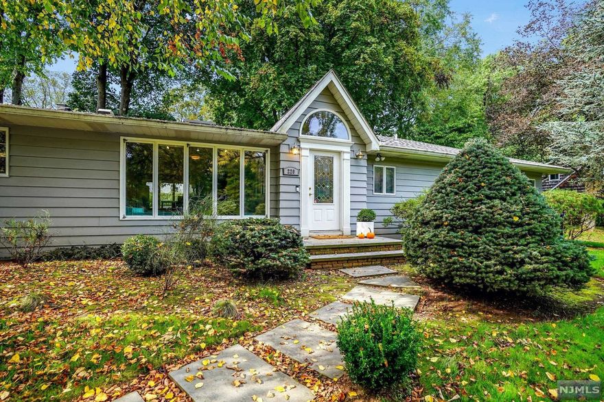 Beautiful 4 BR/3 BTH renovated Ranch. Numerous upgrades. Gorgeous half acre+ property w/patio, deck & more. Slate floor entry hall. LR w/wood burning FPL & floor to ceiling windows. Dining room w/huge window & skylight. Family room opens to patio & backyard. State-of-the-art kitchen w/center island, tons of cabinetry, Wolf range & hood, & black granite countertops. Amazing MBR w/sitting area & WI closets. Master BTH w/rain shower & recessed heat lamps. 3 add'l BR'S & 2 add'l BTH'S. Carpeted basement w/fireplace & ample storage. Plans for a 2 car detached garage w/guest quarters.2 zone gas heat. 2 new hot water heaters. Central AC. Security system. U/G sprinklers. Andersen windows. Sump pump & French drains. Newer roof. A must see!