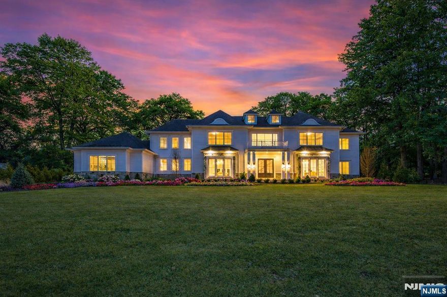 Discover an unparalleled opportunity to own a brand-new custom estate in the prestigious Shadow Lakes Estates. Nestled on a pristine 1-acre lot, this luxurious property features a heated gunite pool and a covered outdoor patio with a fireplace, perfect for year-round entertaining. Expertly crafted by a renowned local builder and interior designer, this over 10,000 sq ft masterpiece spans three levels of exquisite living. Upon entering, a grand foyer leads to a striking library/living room and an elegant dining room. The chef's kitchen is a true showpiece, boasting a secondary prep kitchen, walk-in pantry, and full wet bar, seamlessly flowing into the great room with wood beams and soaring ceilings. The main level also includes a versatile mudroom with garage and patio access, a full bath for pool service, and an en-suite bedroom. The second floor is home to the luxurious primary suite, featuring dual walk-in closets, a spa-like bathroom, a built-in beverage station, and a private balcony. Additionally, four en-suite bedrooms and a spacious laundry room complete this level. The finished lower level offers a state-of-the-art gym, home theater, open recreational space with a wet bar, powder room, and an additional en-suite bedroom. Located in a premier neighborhood with top-rated schools, low taxes, and close proximity to shopping, dining, and NYC, this exceptional residence defines modern luxury living.