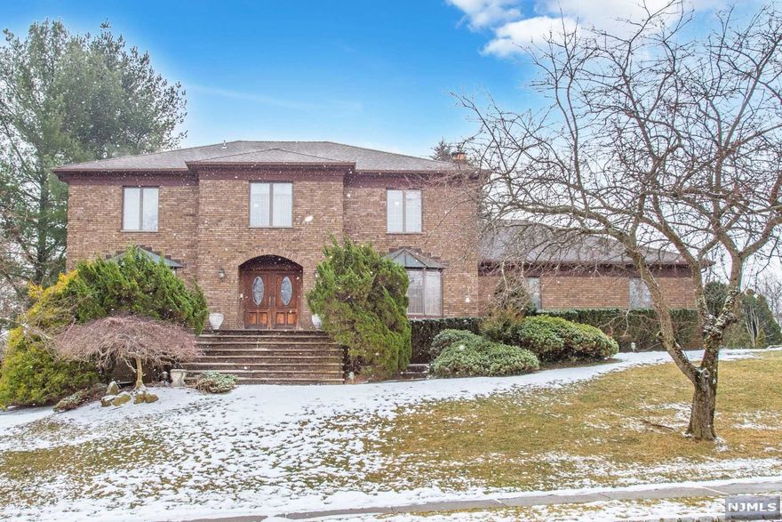 Impressive Brick Front 4/5 Bedroom Center Hall Colonial w/3 car Garage, Walk thru the Double Front Doors into Foyer with Imported Italian Tile, Beautiful Moldings on the Staircase, 32X15 Family Room has Wood Burning Brick Fireplace, recessed lights and sliders to Deck, Sunken Living Room opens to Dining Room with hardwood floor, perfect are a for entertaining! Additional exit to backyard from the Separate Dining Area in the Kitchen,2 Half Baths and the Laundry Room complete the first floor. Second Floor boasts 4 Generous sized Bedrooms,2 Full Baths, Master Bath has Skylight and Jacuzzi Tub,. Lower Level of Home totally finished with Rec Room, Full Bath /steam shower, Office/5th Bedroom. Multizone heat,3 Car Garage, Level Backyard, Expansive Wood Deck all on a Cul-de-Sac street.