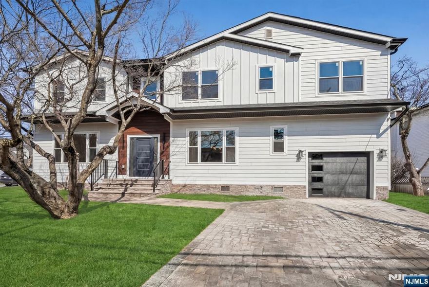 Where modern design meets everyday comfort, this beautifully crafted new construction home offers a sophisticated lifestyle in one of New Milfordâ€™s most convenient locations. Thoughtfully designed with exceptional craftsmanship, high-end finishes & a layout that perfectly balances style & functionality, this home delivers both elegance & ease of living. The main level features soaring ceilings & a bright, open-concept layout, creating a light-filled & inviting atmosphere throughout the living spaces. Sleek architectural lines, designer finishes & carefully curated details give the home a refined, NYC-inspired aesthetic, blending modern sophistication with the warmth & comfort of suburban living. Upstairs, offers five generously sized bedrooms & three full bathrooms, including a luxurious primary suite designed as a private retreat. A Jack-and-Jill bathroom provides added convenience, while the laundry room is thoughtfully located on the same level for everyday ease. The finished basement with an additional powder room expands the homeâ€™s living space, offering endless possibilities for a recreation room, home gym, media lounge, or guest area. Additional highlights include a one-car attached garage, paver driveway, & beautifully finished interiors throughout. Ideally located near the elementary school, close to houses of worship & convenient access to NYC transportation, this home offers the perfect blend of modern living, neighborhood charm & commuter-friendly convenience.