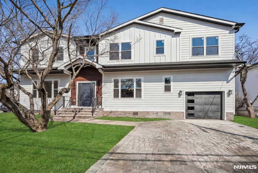 Where modern design meets everyday comfort, this beautifully crafted new construction home offers a sophisticated lifestyle in one of New Milfordâ€™s most convenient locations. Thoughtfully designed with exceptional craftsmanship, high-end finishes & a layout that perfectly balances style & functionality, this home delivers both elegance & ease of living. The main level features soaring ceilings & a bright, open-concept layout, creating a light-filled & inviting atmosphere throughout the living spaces. Sleek architectural lines, designer finishes & carefully curated details give the home a refined, NYC-inspired aesthetic, blending modern sophistication with the warmth & comfort of suburban living. Upstairs, offers five generously sized bedrooms & three full bathrooms, including a luxurious primary suite designed as a private retreat. A Jack-and-Jill bathroom provides added convenience, while the laundry room is thoughtfully located on the same level for everyday ease. The finished basement with an additional powder room expands the homeâ€™s living space, offering endless possibilities for a recreation room, home gym, media lounge, or guest area. Additional highlights include a one-car attached garage, paver driveway, & beautifully finished interiors throughout. Ideally located near the elementary school, close to houses of worship & convenient access to NYC transportation, this home offers the perfect blend of modern living, neighborhood charm & commuter-friendly convenience.