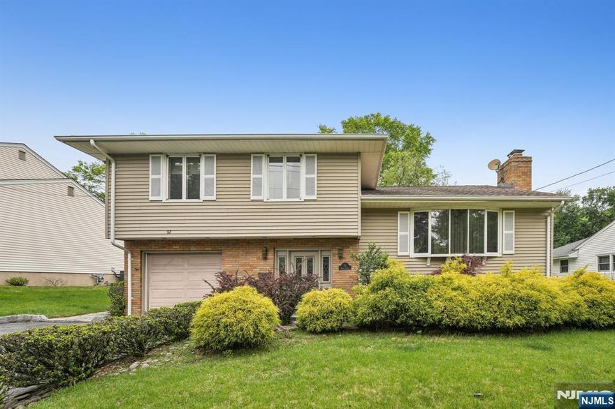 FIRST TIME FOR SALE BY ORIGINAL OWNERS. What a gem! This residence is a meticulously maintained house on a quiet street in a private residential area. Walking distance to schools, churches, parks and public transportation. Step inside the foyer to a sunny family room with sliding glass doors that open to an extended wooden deck and private backyard with lush landscaping. On the second floor enter the large living room with a wood burning fireplace and formal dining room. As an added feature, the open concept kitchen boasts a breakfast eating area and sunroom with floor to ceiling windows. Perfect blend of formal and casual living space ideal for entertaining and outdoor living. A MUST SEE!!!