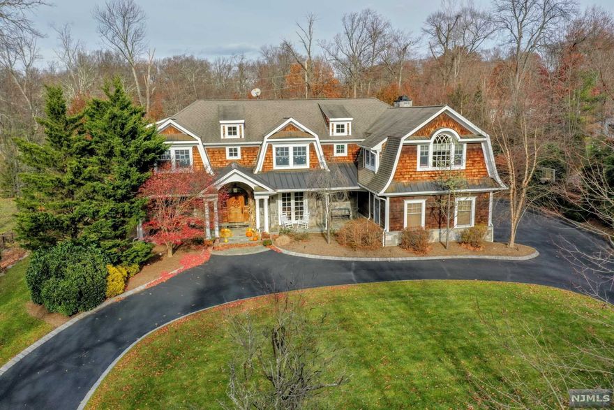This is the one you have been waiting for! Elegant & warm Hamptons style, wood-shake manor built in 2006, prime East-hill location, architectural beauty boasts 6600+ sq ft 1st/2nd fl & newly finished bsmt totaling over 8000 sq ft. 6 ensuite BRS, 7.5 BTHS, dramatic front to back foyer, exquisite mouldings, old-world craftmanship, 10 FT ceilings on 1st fl, huge chef's kitchen w/cntr islnd, top-of line appliances, open to great rm/fam rm w/built ins, FDR w/butler's pantry, walk-in pantry, lrg mudrm, priv library/home office, 1st fl guest suite w/FB & French door to bluestone patio. 2nd fl has 5 ensuite BRS w/WICs, incl luxurious MBR SUITE w/gas FPL, tray ceil, huge spa-like MBTH w/oversized shower/whirlpl tub, dbl custm vanities & window seat. Newly fin bsmt w/media rm, theater seating, pool table, kitchenette, FB, sauna, addl home office, playrm, addl areas for gym, art rm & storage! Gunite salt-water, heated pool w/spa & waterfall. Beautifully landscaped. Move right in & enjoy!
