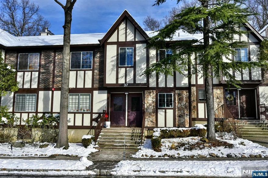 Move right into this well maintained, freshly painted 2-bedroom, 2-bathroom condo featuring an updated kitchen, living/dining room combo, wood-burning fireplace, in-unit laundry, and a covered deck. Additional storage included. Enjoy one floor living and the Ridge Gardens lifestyle with parking, on-site management, and amenities just steps from your doorâ€”outdoor pool, tennis and pickleball courts. Ideally located close to shops, schools, highways, NJ Transit, and minutes from Ramapo Reservation, Darlington Lake, and Campgaw Ski Area. Hiking, skiing, and everyday convenience are all within easy reach. A perfect blend of comfort, location, and community living awaits!