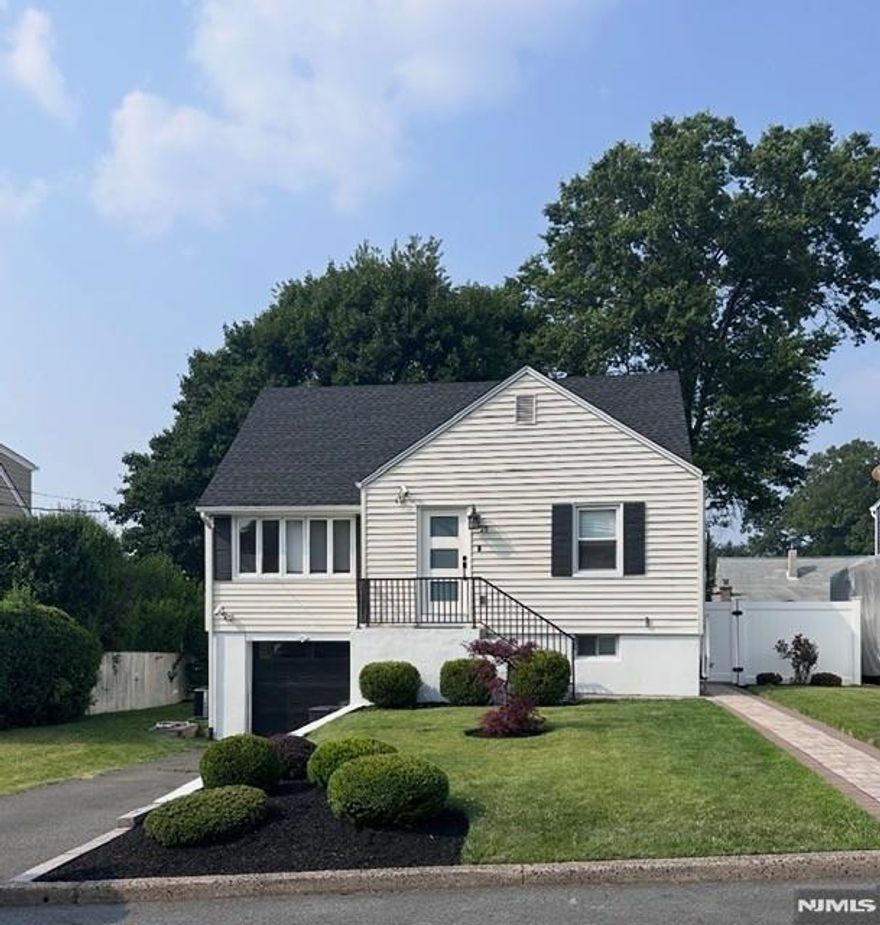 Welcome to this updated Cape Cod home in Woodland Park, NJ, blending classic charm with modern upgrades. At the heart of the home is a chef's kitchen featuring high-end appliances such as a Bertazzoni gas range, quartz countertops, and a functional layout perfect for cooking and entertaining. Aside from the kitchen, the inviting main level includes an open concept living room and dining room. The space opens up to the deck, perfect location for your grill, smoker and/or pizza oven. A full bath and bedroom round out the first floor. The second level is where you'll find two additional bedrooms, a full bathroom and ample closet space. Thoughtful renovations throughout make this home truly move-in ready. Enjoy a private backyard and firepit, ideal for outdoor dining, relaxing, or gardening. The lower level offers a full bath, a second living room, bar area, office space plus additional storage. Let's not forget the EV car charger. Enjoy a newer roof, central air, and newer garage door. Conveniently located near parks, shopping, dining, schools, and major commuting routes, this home offers the perfect balance of suburban living and accessibility. A rare opportunity to own an updated Cape Cod with a true chef's kitchen in one of Woodland Park's most desirable neighborhoods, don't miss it!