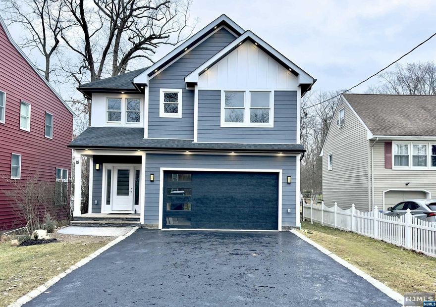 Exquisite 7 bed, 5.5 ba Custom Colonial on a .25-acre R3 plot. Over 5000 sf of living space spanning 3 luxurious floors. 2-story foyer, wide-plank hardwood flooring throughout, custom millwork & trim work. The main floor features a chef's kitchen equipped with SS appliances, one sided waterfall center island, quartz countertops & ceiling-height cabinetry. The dining room sets the stage for memorable gatherings, while the family room, adorned with an inviting electric FP opens up to a paver patio and a fully fenced, flat backyard. 1st fl. en-suite perfect for guests, powder room and a mudroom, ensure effortless everyday living. Ascend to the 2nd fl, 5 s beds, incl. a lavish Primary Suite w large custom walk-in closet, spa-like ensuite bath w soaking & dual sinks. Unwind and entertain in style within the fully fin. basement, offering a rec rm, an additional Bed rm, and a full bath, providing endless possibilities for relaxation and recreation. Comes with10-YEAR BUILDER WARRANTY