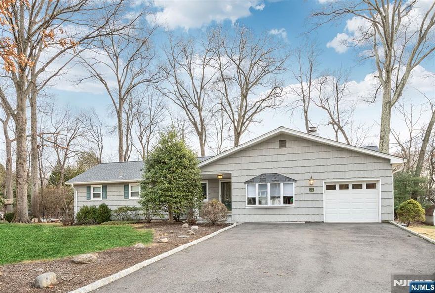 This charming three bedroom, 1.5 bathroom ranch home offers easy one-floor living. The spacious living area loaded with natural light flows into the formal dining room, leading to a large deck perfect for entertaining. The cozy family room with a wood-burning fireplace and an upgraded eat-in kitchen make this home extremally inviting and functional. The large flat backyard offers private outdoor space, and the unfinished basement is ready for storage or finishing. With a newer roof, HWH and HVAC system this home is truly move-in ready. Located near both the Waldwick and Wyckoff downtown areas, McFaul Environmental Center-convenient to everything both towns offer! Just unpack your bags!