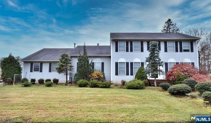 Step into an inviting entry foyer that sets the tone for this beautifully maintained home. The formal dining room boasts hardwood floors, crown molding, and decorative shadow boxes. The living room features hardwood flooring and French doors leading to a spacious family room with vaulted ceilings, gas fireplace, and more gleaming hardwood floors. The updated kitchen includes granite countertops, a double wall oven, and a bright dining area with sliders to a 48' x 12' deckâ€”24 feet of which is covered and equipped with dual ceiling fans, perfect for outdoor entertaining. The first floor also offers a convenient laundry room. Upstairs, you'll find a large game room with sliders to the deck (easily convertible to a 6th bedroom), a loft overlooking the family room, and a spacious 5th bedroom located above the garage. Additional features include 2-zone central air conditioning, a paver driveway and walkways, and countless other upgrades throughout.
