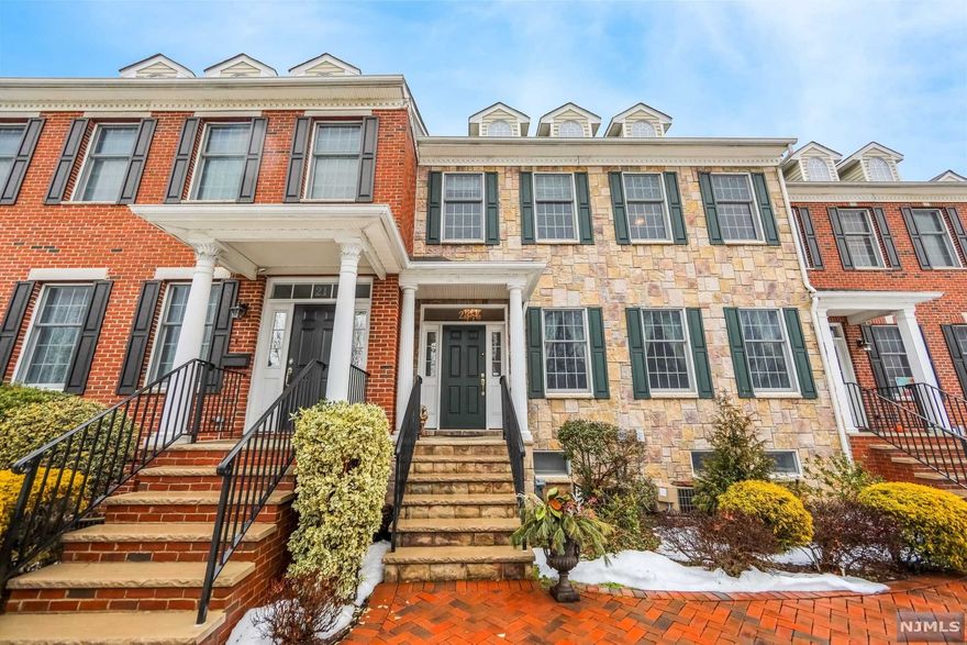 Welcome to your beautifully designed, spacious townhome in Rutherford! Boasting over 3000 square feet of living space, this home features modern renovations, mahogany hardwood floors, meticulously crafted lighting and surround sound speakers throughout. The Chef's Dream kitchen, with stainless steel appliances, white quartz countertops and custom cabinetry, connects to an open concept living space (with gas fireplace) and expansive deck terrace. Upstairs are 3 large bedrooms and 2 full bathrooms, including a master bedroom suite, complete with a HUGE walk-in closet and double-vanity bathroom. Downstairs holds an extra play/bedroom attached to a 3 car garage. Close to Park Avenue restaurants & shops and Rutherford's Blue Ribbon schools. Easy access to trains, buses, highways and NYC commute.