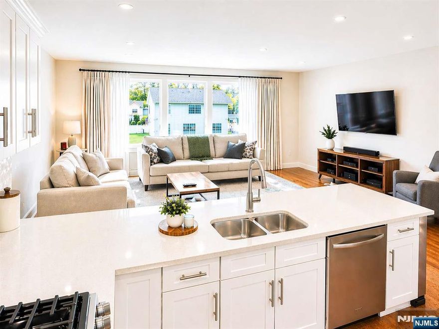 No monthly HOA fee, newer construction, private fenced yard larger than most townhomes offer, and a walkable train commute to NYC, an extremely rare combination. Move-in ready, this 4 bedroom, 3.5 bath home offers approximately 2,300 sq ft of modern living space, garage parking, a two car driveway, and additional street parking. The main level features an open concept layout with a chefâ€™s kitchen, brand new quartz countertops, stainless steel appliances, dining area, spacious living room, and half bath. Upstairs offers three bedrooms and two full baths, including a primary suite with walk in closet and en suite bath. Ground level includes a fourth bedroom, full bath, and garage access. Located on a quiet non through street just steps from shops, restaurants, parks, and everyday conveniences, with an easy walk to the train for commuting to NYC. Located in highly rated Waldwick with top rated schools, surrounded by Bergen County favorites including Ridgewood, Ho Ho Kus, Allendale, and Saddle River. Minutes to downtown Ridgewood, Whole Foods, premier shopping, dining, and major malls. Rare opportunity to own a low maintenance newer home with privacy, outdoor space, and commuter convenience in one of Bergen Countyâ€™s most desirable locations.