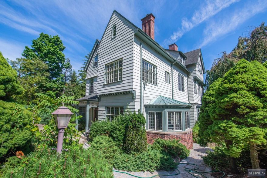 Add your legacy to this Queen Anne Victorian Circa 1858 with well preserved original architectural details & modern amenities to boot. Private setting off one of Montclair's most desirable streets with over an acre of mature landscaping & in-ground pool. The newly renovated carriage house sits atop a four car over-sized garage w/ private deck greets you as you enter the property. As you pull into the formal courtyard the beauty of this amazing time piece reveals itself. The entrance foyer offers the 1st of 7 unique historic fireplaces and is highlighted by stained-glass, leaded windows, & inlaid floors. A 19ft x 33ft great room shares even more of the history with custom ceilings & another one of a kind fireplace w/ detailed wood work only seen in the most prestigious of homes of that era. Formal dining room, library, solarium, 2 baths, & EIK complete the main level. MBR w/ newly renovated spa like bath with freestanding & shower, WIC & sitting rm. complete the primary suite.