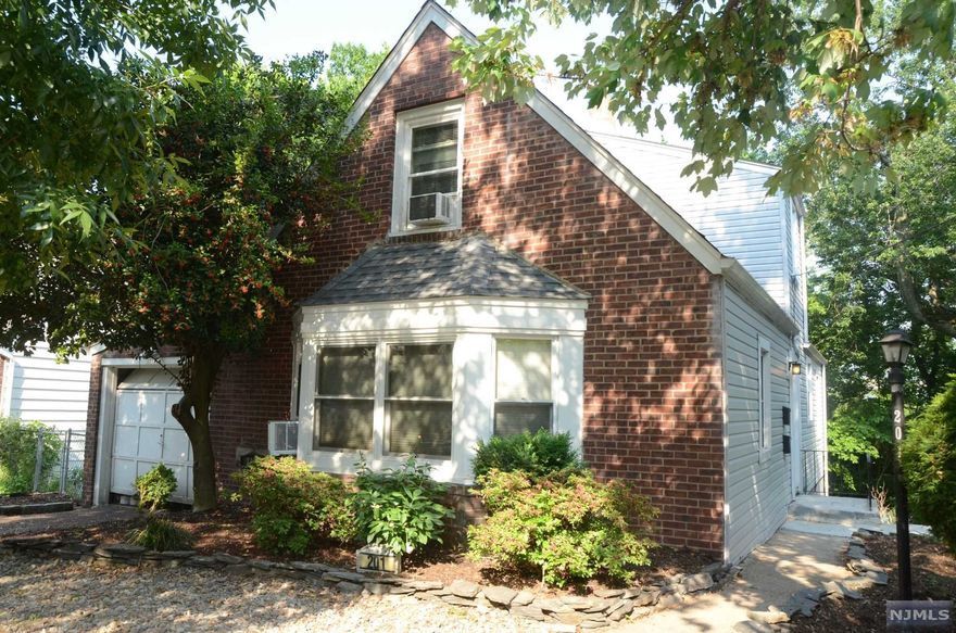 Great two family home nested on a quite tree line street, this home features 2 large units and huge private yard. First unit has two levels of living space including walk out basement with 2 bedrooms and two baths. Second unit is very spacious and has one bedroom and one bath. Do not miss an opportunity to own this two family home!