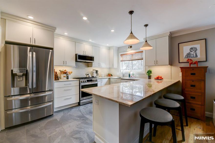 Updated Shea featuring large rooms and ample closet spaces. Beautifully renovated kitchen tailored for avid home cooks with accessible drawers for cookware, tools and tableware. Includes new appliances and exterior vent fan. Spacious Taj Mahal quartzite countertops provide plenty of room for cooking and entertaining. Updated hot water heater and central air conditioning. White oak hardwood flooring throughout, with lower-level floors enhanced by added acoustic insulation. New windows and patio door are complimented by updated interior doors, and moldings. Convenient laundry area equipped with washer, dryer, utility sink, fold-out drying rack, and plenty of concealed storage. Rare 3 car parking spaces, including two covered in the carport, along with an additional storage unit. Enjoy a private balcony for your own outdoor retreat, along with beautifully maintained community grounds featuring scenic walking paths, seasonal pool, tennis courts, basketball court, playground, dog park, and kayaking dock. Residents also have access to the Cove Club bar and clubhouse for gatherings and events. Excellent commuter location, with multiple rush-hour routes to Manhattan. A 5min walk to a bus stop, or NJ Transit train, that is one stop from to Penn Station.
