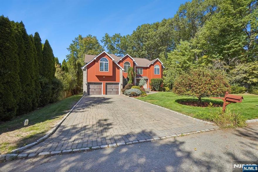 Welcome to this beautifully maintained 5-bedroom, 3.5-bathroom home that perfectly combines comfort, modern updates, and flexible living for today's lifestyle. The second floor features four generously sized bedrooms, including a luxurious master suite with its own full bath. Both upstairs bathrooms were tastefully renovated in 2020, offering a fresh, modern design. On the first floor, you'll find a bright bedroom and a convenient half bath, renovated in 2025. The inviting family room boasts soaring high ceilings, creating an airy and open atmosphere ideal for gatherings. One of the home's most unique highlights is the separate mother-daughter suite on this level complete with its own kitchen, living room, bathroo and private entrance perfect for guests seeking independence while staying close. The fully finished basement provides additional versatile space for recreation, a home office, or a gym. Step outside to enjoy a peaceful backyard with a spacious deck, ideal for summer barbecues, entertaining, or simply relaxing. Nestled on a quiet street, this home offers privacy and tranquility, while still being conveniently close to schools, shops, and major commuting routes.Don't miss this rare opportunity to own a move-in ready home with space, updates, and flexibility for every lifestyle!