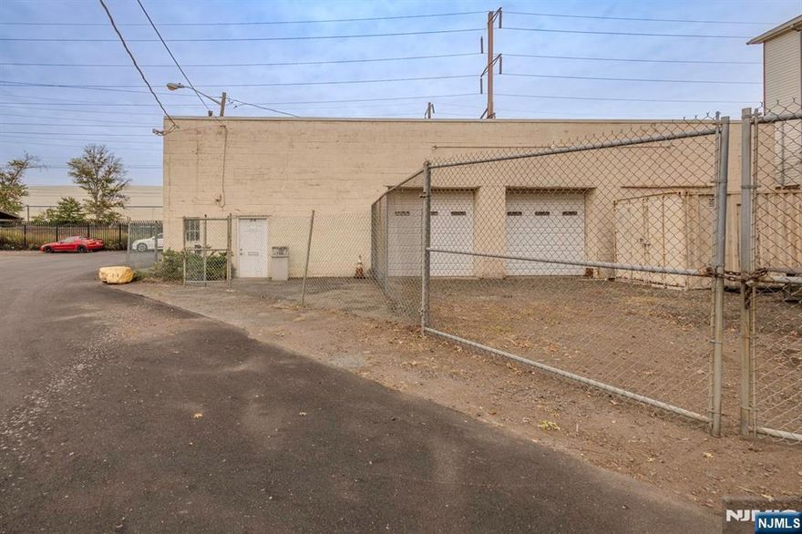 Corner property, Lot size approx. 5000 sq ft, Building is 1450 sq ft, 3 large overhead doors, 10x15 Mezzanine office with large observation window, off street parking fenced yard. There is an outside trailer with interior lighting and shelving. Property is minutes to Newark airport/seaport/rail and major highways