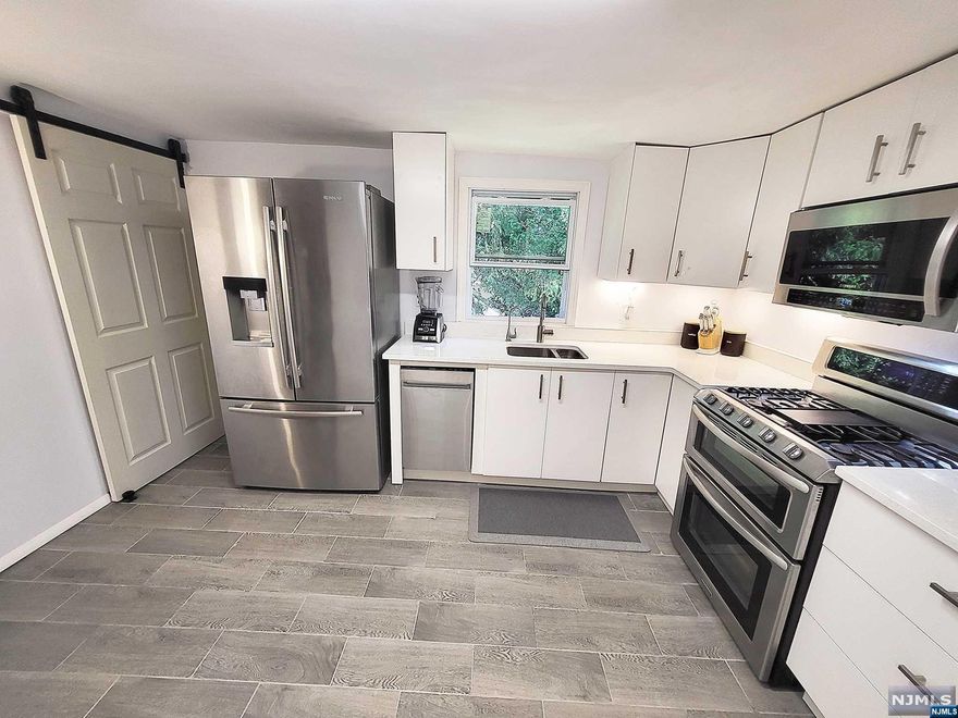 BRAND NEW Septic. House is remodeled and converted into a semi smart home. The House features an updated and remodel Kitchen and Bathroom. Bath has a jet tub and smart color changing lights for a more welcoming relaxation experience. Main floor bedrooms and living room have also been added smart home fixture such as digital thermostat and Alexa and or google controlled lights and door lock. Kitchen offers stainless steel appliances, built in reverse osmosis water filter, three door refrigerator with ice maker and filtered water, dishwasher, under cabinet microwave oven/vent and a dual oven gas stove. Gas water heater 2015, Generator line. Den can be used as 3rd bedroom. Walk out basement. Samsung Laundry Machines. Parking space for more than 5 vehicles. Backyard and front yard are perfect for entertaining. Front yard offers a Wooden gazebo and concrete floor. Schools are very close. Walking distance to bus 194 which leads to NYC Port Authority