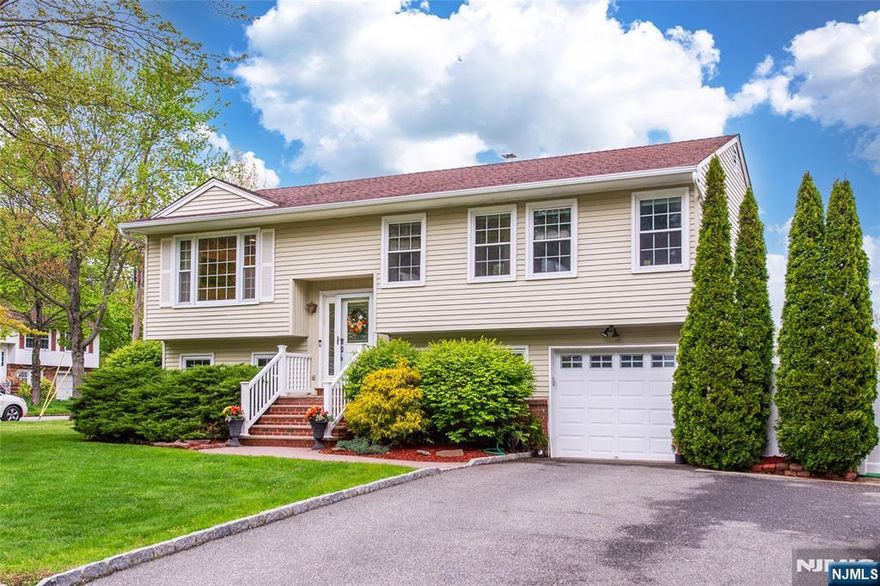 Pristine, Stunning, well maintained home in a very desirable section of Lake Hiawatha. Neighborhood has underground electrical wirings. It features: 4BRs, 2Fbaths, engineered hardwood floors thru out the house, central air, updated kitchen and baths. Steps away from Volunteers Park, Tesla charger in the garage and home warranty for appliances and furnace - another 3 year left with coverage of $11,000. An opportunity to avail the Lake Hiawatha membership club.