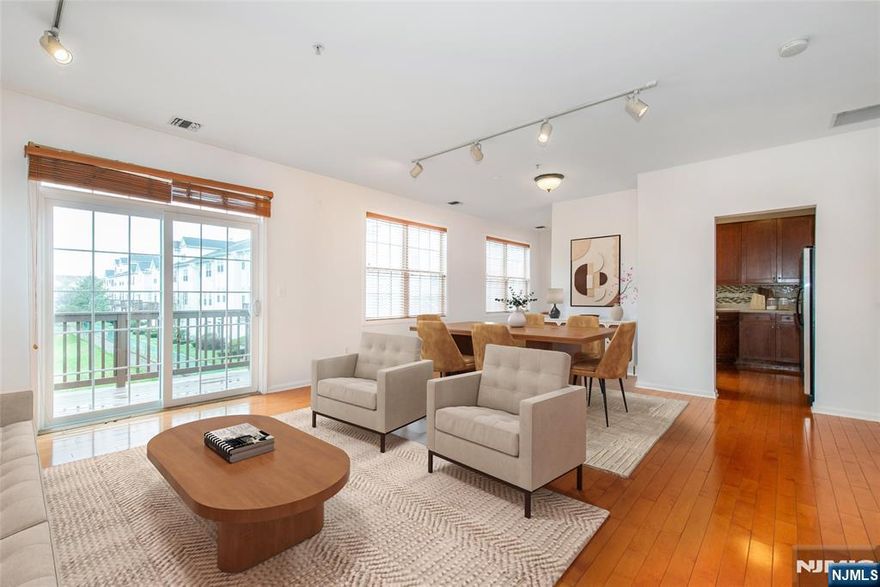 Stunning end-unit multi-level townhome - one of the largest in Cambridge Crossings. This home features hardwood floors, 42 inch cherry cabinets, Corian counters, ss appliances, breakfast nook, marble fireplace, a large deck off the living room, two en suite bedrooms with walk-in closets, three zone heating and cooling, attached garage, and much more! This community offers a pool, clubhouse, 24-hour exercise room and saunas. The NYC bus and Clifton Train Station are less than a mile away.