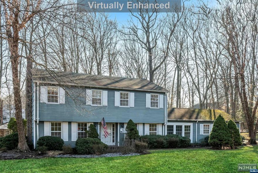 Amazing West Hill Location! 5 Bedroom, 3 1/2 Bathroom Colonial with more than half acre property on beautiful tree lined street. You will love the first floor living space with it's spacious living room and family room as well as a bonus room that could be used as a den, office or guest room. The eat-in-kitchen has sliding doors to the backyard and easy access to the mudroom and garage. Upstairs you will find two primary bedrooms with en-suite bathrooms as well as three additional bedrooms and a 3rd full bathroom. Additional features include hardwood flooring, laundry room and 2 car garage. Make this your own in one of the BEST LOCATION around! Woodcliff Lake has Award Winning Schools, train and bus lines for commuting, town pool, athletic programs, great shopping and a wonderful community. Don't miss this opportunity! Survey and floor plans available.