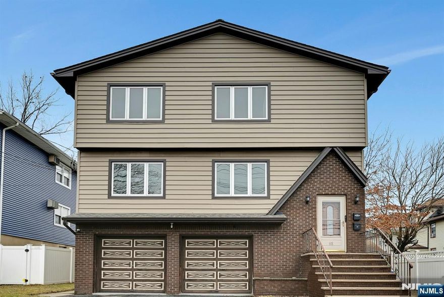 THIS FABULOUS 2 FAMILY BUILT IN 1977 FEATURES 6 ROOMS OVER 6 ROOMS WITH FINISHED GROUND FLOOR. EACH APARTMENT HAS THE SAME SET UP. WALK UP TO THE 1ST FLOOR APARTMENT FEATURING A HUGE LIVING ROOM WITH AMPLE LIGHTING. THE MODERN EAT IN KITCHEN OFFERS GRANITE COUNTER TOPS AND A BREAKFEAST ISLAND. ENTER THE FORMAL DINING ROOM, WALK DOWN THE HALL TO THE MASTER BEDROOM WITH FULL BATH AND DOUBLE CLOSET'S, 2 ADD'L LARGE BEDROOMS AND A 2ND FULL BATH. 2ND FLOOR IS SAME AS THE 1ST FLOOR EXCEPT MASTER BEDROOM HAS WALK IN CLOSET. GROUND FLOOR SET UP HAS SEPARATE SIDE ENTRANCE WITH HUGE KITCHEN AREA, ANOTHER ROOM WITH FULL BATH AND 3RD ROOM OFFERS A HUGE FAMILY ROOM. AMENITIES INCLUDE ALL HARDWOOD FLOORS, GAS HOT WATER BASEBOARD HEAT,LARGE BACKYARD, 2 CAR GAGAGE. BUS TO NYC AT THE CORNER