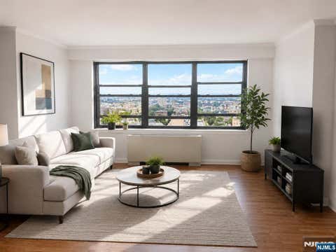 Photo of 285 Aycrigg Ave #20C, Passaic, NJ 07055 (MLS # 26018224)