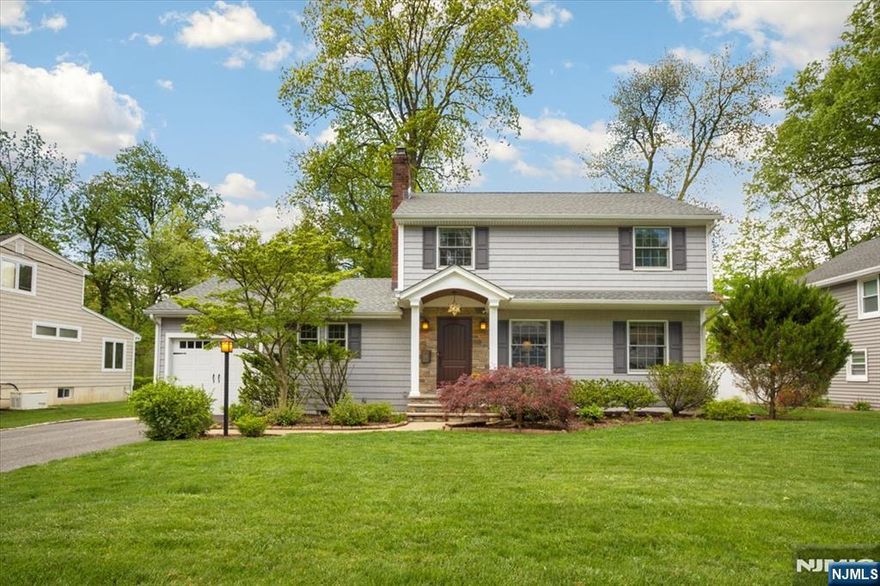 Stunning renovated Colonial in prime Livingston location! This 3BR, 2.5BA home blends classic charm with modern luxury. Renovated in 2011 with thoughtful design and upscale finishes. Chef's kitchen w/ 60" Wolf range, 48" built-in fridge, oversized island, pantry & sunlit den w/ vaulted ceilings & gas fireplace. Sliding doors to covered porch & paver patio. Main level includes formal DR w/ fireplace, living room, butler's pantry, powder room, office/guest room & walk-in coat closet. Upstairs, primary suite w/ 2 walk-in closets, spa-like bath. Two BRs share full bath. Finished basement, 2-zone A/C, 5-zone heat, hardwood floors, fenced yard, garage + 4-car drive. Generator-ready. Near parks, schools, town center.