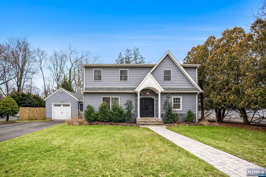 ** COMING SOON - SHOWINGS BEGIN AT OPEN HOUSE ON 2/5 ** Move right into this fully updated 4 bedroom and 3.5 bathroom center hall colonial! This remodeled home has over 2400 square feet of living space with an open floor plan along with a recently remodeled kitchen with quartz countertops and stainless steel appliances. Dining area has direct access to the large deck with hookups for a hot tub. The first floor has 1 full bedroom and bathroom. Upstairs there are 3 spacious bedrooms (including the master bedroom with master bathroom and walk in closet) as well as another full bathroom and laundry. Full wet bar, kegerator and drink fridge in the basement with family room and a half bath. Schedule your private viewing today!