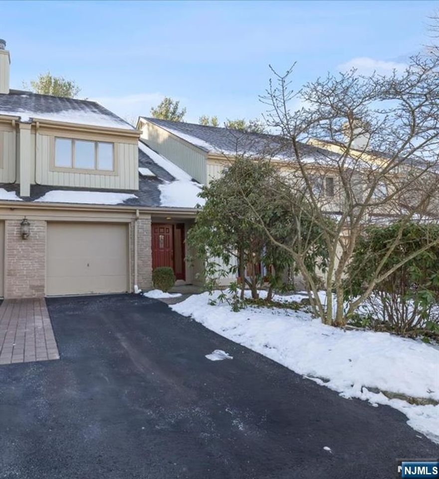 Welcome to this updated Greenway style townhome in the desirable Ramapo Ridge development. This home is located on a cul-de-sac w/ plenty of parking, including a 2 car driveway & attached garage. This unit DOES NOT BACK UP TO 287. Enter thru the front door w/ soaring ceiling & half bath. Steps bring you to the main living area including beautiful kitchen w/ white cabinets, granite, oversized island w/storage on both sides & ss appliances. Kitchen opens to dining room & living room. The generously sized living room features a gas fireplace & sliding glass doors to a private deck w/ a serene wooded view. Steps then lead to a landing w/ skylight, bedroom & full bath. Another short set of steps leads to the large primary suite which offers a spa-like bath with a soaking tub and oversized seamless-glass shower. The finished basement provides flexible space for a family room, home office, or gym. RENOVATIONS INCLUDE *Complete renovation of kitchen (2018) *New wood floors main level (2018) *Complete renovation of basement (2018). This townhouse is truly move-in ready! Resort-style community amenities include a clubhouse, outdoor pool, gym, tennis courts, basketball, and other sport courts. All just minutes from schools, shopping, dining, and major routes.