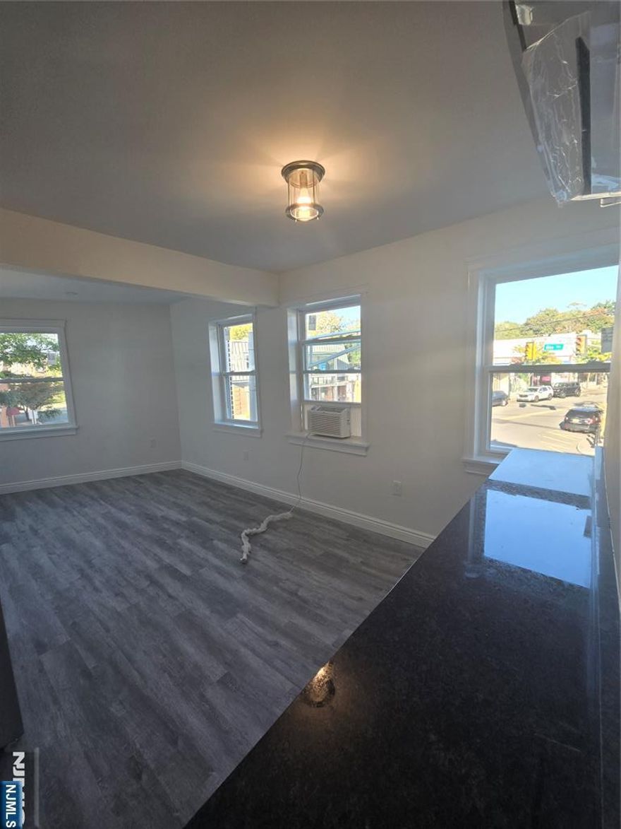 Fully renovated 2-bedroom apartment in the center of downtown Glen Rock at the corner of Glen & Rock. Brand new bathroom, kitchen, windows, flooring, and featuring new wall-mounted heating and cooling units throughout (tenant controlled). Open floor plan between kitchen and living area. All new stainless steel appliances and fixtures. Large bedroom closets feature built-in shelving/drawers as well as hanging rods. On-site parking. One block from train and bus direct to NYC. Ideal for NYC commuters or people looking to downsize from a house but want to stay local. Agent is related to landlord.