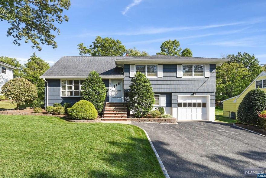 Pride of ownership is evident in this very well-built and lovingly maintained Split-Level in the desirable town of West Orange. Located in the Oakes section on a quiet cul-de-sac, this home features four spacious bedrooms w/ excellent closet space, two full and one half bathrooms, a master bedroom with full bathroom, eat in kitchen with separate dining area, living room, huge family room, laundry room, and a basement with plenty of storage space. Central Air, Hardwood flooring under the carpet, attached 1-car garage and driveway parking for 4. The private, level backyard is perfect for entertaining and relaxing. Convenient to shopping, major highways, public transportation, schools, and the Turtle Back Zoo. This home is a rare gem!