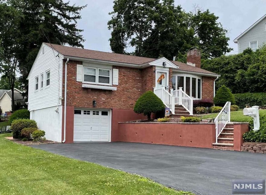 Recently renovated 2 bedroom, 1.5 bath ranch (with additional bedroom on the lower level) on quiet tree lined street ending in a cul-de-sac. Roof approx 5 years old. Brand new 200 amp electrical service, renovated baths, beautiful 1 year old kitchen with quartz counters, soft close draws and under cabinet lighting. Fireplace, one car garage, alarm, central air and enjoy a climate controlled sun room all year round. The exterior consists of a wrap around deck with pergola, two patios and extensive landscaping/low voltage lighting around the entire property. School bus stops at corner.