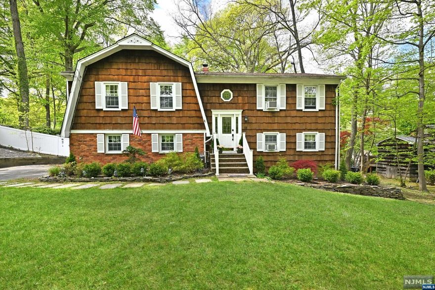 Enjoy all that Ringwood has to offer in this 3 bedroom 2 bath home on one of the town's most desirable streets in the Cupsaw Lake community. Escape to your private, fenced in backyard retreat with a fantastic view of a Koi Pond, large grassy area and beautiful gardens. Offering 2278sf of living space, the main level of the home includes 3 bedrooms, 2 full baths and hardwood floors throughout. The dining room has glass doors that lead to an oversized 3 season covered deck perfect for outdoor entertaining! The kitchen boasts stainless steel appliances, center island and granite counters. The lower level is finished and includes a family room with glass doors to expansive yard with paver patio, office/bedroom, a bonus room/craft room and laundry room. Other features include a newer furnace, a whole house attic fan, an attached 1 car garage and large driveway. Town verified 3 bedroom septic. Optional lake association membership available. Home being sold as is. No known issues.