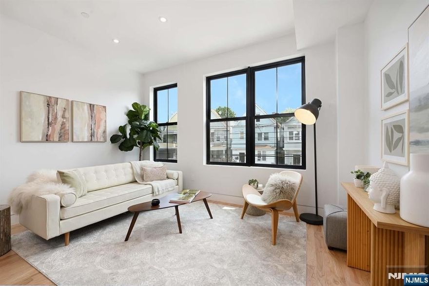 Welcome to 29 Armstrong Avenue, a brand-new, meticulously designed 3-bedroom, 2-bathroom condo offering thoughtfully crafted living space in Jersey Cityâ€™s booming Greenville neighborhood. This penthouse-level unit features a bright, open-concept layout with 11-foot ceilings, 8-foot doors, and Reveal modern trims that enhance the homeâ€™s sleek, contemporary aesthetic. One of the standout features is the private roofdeckâ€”perfect for outdoor dining, relaxation, or entertaining guestsâ€” with stunning NYC skyline views. The modern kitchen is equipped with quartz countertops, stainless steel appliances, a spacious island ideal for gatherings, and a stylish dry bar for added functionality. Additional highlights include hardwood floors throughout, central air with air handler, in-unit Samsung washer/dryer, WiFi-enabled locks, and a sprinkler system. All three bedrooms are generously sized, including a serene primary suite with ample closet space and a modern ensuite bath. Situated near parks, the light rail, and popular local destinations, this condo offers the perfect blend of comfort, convenience, and urban living in one of Jersey Cityâ€™s most exciting communities.