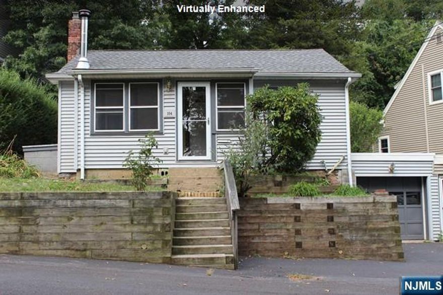 Indian Lake Home for Sale! A wonderful opportunity to own in Denville at a great price point. This charming ranch-style home features hardwood floors and painted interiors in warm, neutral tones throughout. The bright living room flows into a functional kitchen with pantry and mudroom. Two bedrooms and a full bath complete the main living level. Enjoy the enclosed sun porch perfect for morning coffee or relaxing evenings. The home offers a large, spotless full basement with laundry area, workshop space, and abundant dry storage. Basement access is available through the garage or sun porch. One-car garage plus off-street parking. Step outside to a private backyard with patio area ideal for entertaining or unwinding. Located in the desirable Indian Lake community with access to clubhouse, three beaches, boating, fishing, and swimming. Walkable to downtown Denville, grocery store, restaurants, shopping, and NYC-direct train and bus service. Convenient to major highways. An excellent value for Denville living with both lake-community amenities and unbeatable walk-to-town convenience.