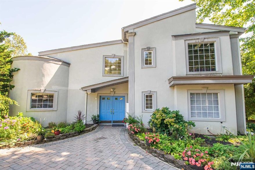 Welcome to this custom-built Ringwood home with 4 bedrooms and 3 bathrooms, designed for luxurious living. The living room boasts large windows, perfect for relaxation and entertaining. French doors lead to a dry bar and formal dining room, ideal for gatherings. The gourmet kitchen features stainless steel appliances, granite countertops, a center island, and maple cabinetry. The main level includes a family room with a wood-burning fireplace, two bedrooms, and a full bath. Upstairs, find two large bedrooms, including a bright primary suite with skylights, a walk-in closet, and an en-suite bath. The finished basement offers a rec room and walk-out access to a multi-tiered patio. The landscaped backyard is perfect for outdoor dining and relaxation, blending style, comfort, and convenience in a prime location.