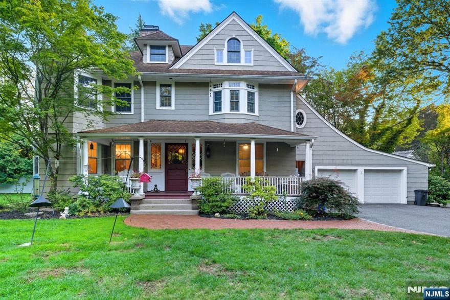 Stunning East Hill 6-bedroom Grand Center Hall Victorian set on over half an acre, blending timeless charm with modern comfort. This elegant home features soaring ceilings, original custom woodwork, lathe windows, hardwood floors, and exquisite detail throughout. A welcoming front porch leads into a grand entryway flanked by an oversized living room and formal dining room, both with character-filled fireplaces. The first floor also offers an eat-in kitchen, office, laundry, mudroom, and attached 2-car garage. Upstairs, the primary suite includes his & hers closets, office space, and a beautifully renovated bath, joined by three spacious bedrooms and an additional full bath. The finished attic provides two bedrooms, a full bath, and playroom. With a fantastic location close to transportation, downtown Tenafly, blue-ribbon schools, and houses of worship, this rare offering is a must-see!