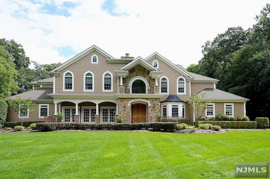 Enter thru the Mahogany front doors to a 2-story foyer with a curved staircase flanked by a banquet sized DR and a lovely LR with a dual fireplace to the great room. The GRT RM, with 18' ceiling and walls of glass, overlooks the resort style property. The expansive kitchen opens to a sun filled breakfast area surrounded by windows. The primary wing includes dual offices, BR with FPL, 2 walk in closets and onyx countertops in the spa like BTH. 1st floor is complete with a gym, FBTH, large pantry, mudroom, PR. The 2nd floor has four generous BR's, 2 marble FBTH's.The magnificent rear oasis includes the Gunite pool, pool side pavilion, surrounded by a 58' Koi pond with 2 streams, 3 waterfalls and 3 bluestone bridges. The patio is complete with an outdoor kitchen and dining areas. A walking path surrounds the rear yard. Attention has been paid to every detail in this custom home. Truly a MUST SEE!!