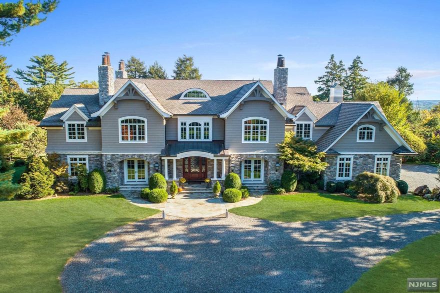 This is a cedar shingle & stone Manor custom designed, oriented & built to capture the spectacular views of its southern high point exposure. Its location on a high hill amid the surrounding woodland residential and natural preserve area, away from main thoroughfares create a peaceful idyll for gracious & relaxed living. No expense has been spared. The custom built Kitchen has dual Sub-Zero refrigerators, dual Bosch dishwashers, Miele ovens, Wolf cooktop, & walk-in pantry. The Kitchen's large dining area with travertine tile flooring opens directly into the sunken great room crowned with coffered ceiling and opens to the upper stonewalled bluestone patio. This home offers 5-6 bedrooms, including a spacious tray ceiling Master Suite with luxury bath, his & her walk-in closets, and a private study with a travertine hand-carved fireplace mantle. The Garden level offers a multi-generational suite with kitchen, walk-in shower & private access to lower level bluestone patio. A must see!