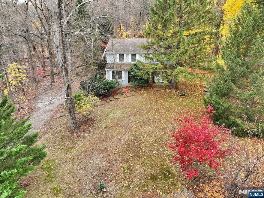 Set on an exceptionally deep and expansive lot (.93 acre), this fixer-upper property offers an exciting opportunity for both savvy homeowners and investors looking to rehab and capitalize on a prime Ramsey location. A rare find in Bergen County, the land offers space for a significant addition, a sprawling patio, an outdoor kitchen, or even a pool - all in a private, natural setting. The existing structure is primed for a full renovation or potential rebuild, allowing you to customize every detail, from the layout and finishes to the ultimate curb appeal. Capitalize on Ramsey's allure and desirability, including top-rated schools, a vibrant downtown, and a safe, serene atmosphereâ€”with unbeatable commuter convenience via the NJ Transit train to NYC. ***Buyer responsible for all town inspections and continued certificate of occupancy, smoke and fire certification.***